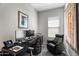 Inviting home office space with a work desk and ergonomic chair with modern decor and lighting at 18129 N 65Th Pl, Phoenix, AZ 85054