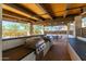Outdoor kitchen with built-in grills and counter space, perfect for entertaining at 18129 N 65Th Pl, Phoenix, AZ 85054