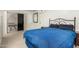 Bedroom featuring carpet, a comfortable bed, sliding glass doors, and a closet for storage at 2122 W Piccadilly Rd, Phoenix, AZ 85015
