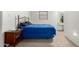 Cozy bedroom featuring carpet, a comfortable bed, and a dresser for storage at 2122 W Piccadilly Rd, Phoenix, AZ 85015