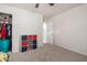 Bedroom featuring neutral carpet, closet, and an adjacent bathroom door at 2122 W Piccadilly Rd, Phoenix, AZ 85015