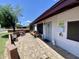 Inviting front porch with decorative tile, seating area, a security door, and a well-maintained exterior at 2122 W Piccadilly Rd, Phoenix, AZ 85015