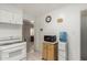 Kitchen featuring essential appliances, a water dispenser, and a view into an adjacent room at 2122 W Piccadilly Rd, Phoenix, AZ 85015