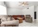 Bright living room boasting tile floors, a ceiling fan, and ample seating with sectional sofa at 2122 W Piccadilly Rd, Phoenix, AZ 85015