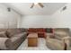 Inviting living room featuring tile floors, a ceiling fan, and a comfortable sectional sofa at 2122 W Piccadilly Rd, Phoenix, AZ 85015