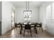 Dining room features a modern light fixture and plantation shutters for a comfortable, elevated space at 22714 E Parkside Dr, Queen Creek, AZ 85142