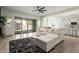 Bright living space with sliding glass doors and an open connection to the modern kitchen at 22714 E Parkside Dr, Queen Creek, AZ 85142