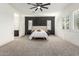 Spacious main bedroom features a large carpeted area, fan, and an ensuite bathroom at 22714 E Parkside Dr, Queen Creek, AZ 85142