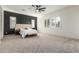 Spacious main bedroom featuring neutral colors, carpet flooring, and plantation shutters for natural light at 22714 E Parkside Dr, Queen Creek, AZ 85142