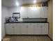 Wall of white cabinets with dark countertop at 2511 N 56Th St, Mesa, AZ 85215