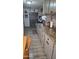 Bright kitchen featuring light gray cabinets, stone countertops, and modern appliances at 2511 N 56Th St, Mesa, AZ 85215