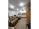 Cozy living room featuring a comfortable sofa, entertainment center, and ample storage at 2511 N 56Th St, Mesa, AZ 85215