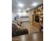 Cozy living room featuring a comfortable sofa, entertainment center, and ample storage at 2511 N 56Th St, Mesa, AZ 85215