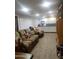 Cozy living room featuring a comfortable sofa, entertainment center, and ample storage at 2511 N 56Th St, Mesa, AZ 85215