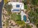 A bird's-eye view of the property, highlighting the pool, solar panels, and well-maintained landscaping at 28045 N 112Th Pl, Scottsdale, AZ 85262