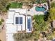 Aerial view showcases rooftop solar panels and a stunning pool with a spa at 28045 N 112Th Pl, Scottsdale, AZ 85262
