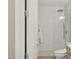 Bright bathroom features tiled shower with rain shower head and toilet with a bidet attachment at 28045 N 112Th Pl, Scottsdale, AZ 85262