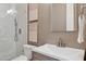Tastefully designed bathroom with a modern vanity, framed artwork, and subway tile shower at 28045 N 112Th Pl, Scottsdale, AZ 85262