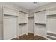 A spacious walk-in closet with custom shelving and wooden floors provides ample storage space at 28045 N 112Th Pl, Scottsdale, AZ 85262
