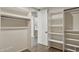 Spacious closet with shelving on both sides and access to ensuite bathroom at 28045 N 112Th Pl, Scottsdale, AZ 85262