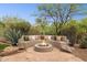 Outdoor area with built-in seating and fire pit, perfect for entertaining at 28045 N 112Th Pl, Scottsdale, AZ 85262