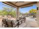 Covered patio area has comfortable seating and a view of the pool and desert landscape at 28045 N 112Th Pl, Scottsdale, AZ 85262