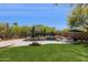 Desert landscaping surrounds the pool area creating a serene backyard retreat at 28045 N 112Th Pl, Scottsdale, AZ 85262
