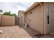 Enclosed backyard with gravel landscaping, an AC unit, and stucco wall at 3022 N 148Th Ave, Goodyear, AZ 85395