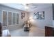 Cozy bedroom showcasing a plush chair and bright window with plantation shutters at 3022 N 148Th Ave, Goodyear, AZ 85395