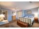 Cozy bedroom with carpet, cool color palette, ceiling fan and closet at 3022 N 148Th Ave, Goodyear, AZ 85395