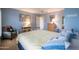 Spacious bedroom with carpet, cool color palette, ceiling fan and closet at 3022 N 148Th Ave, Goodyear, AZ 85395