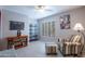Bedroom showcasing a comfortable chair, ottoman, and shelving unit for storage at 3022 N 148Th Ave, Goodyear, AZ 85395