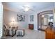 Bedroom with a stylish chair and ottoman complemented by art and decorative elements at 3022 N 148Th Ave, Goodyear, AZ 85395