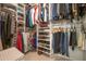 Organized walk-in closet with ample shelving, hanging rods, and storage space for clothes, shoes, and accessories at 3022 N 148Th Ave, Goodyear, AZ 85395