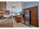 Bright kitchen featuring stainless steel appliances and updated cabinets at 3022 N 148Th Ave, Goodyear, AZ 85395