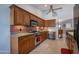 This kitchen features wood cabinets, stainless steel appliances, and stylish tile backsplash at 3022 N 148Th Ave, Goodyear, AZ 85395