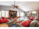 Spacious living room featuring vaulted ceilings, an entertainment center, and tile flooring at 3022 N 148Th Ave, Goodyear, AZ 85395