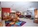 Open-concept living space with a dining area, kitchen bar, and comfortable living room at 3022 N 148Th Ave, Goodyear, AZ 85395