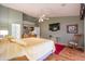 Spacious main bedroom with wooden floors, ceiling fan, and access to the bathroom at 3022 N 148Th Ave, Goodyear, AZ 85395