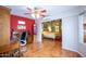 Cozy office with wood floors, a built-in desk, and a connecting view into the bedroom at 3022 N 148Th Ave, Goodyear, AZ 85395