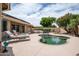 Backyard with a sparkling pool, lounge chairs, and a well-manicured yard at 3022 N 148Th Ave, Goodyear, AZ 85395