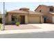 Charming single-story home featuring a low-maintenance desert landscape and a two-car garage at 3559 N 143Rd Ave, Goodyear, AZ 85395