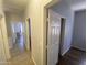 Hallway leading to bedroom with hard surface floors at 3559 N 143Rd Ave, Goodyear, AZ 85395