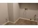 Functional laundry room with tile flooring and essential utility connections at 3559 N 143Rd Ave, Goodyear, AZ 85395