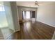 Serene main bedroom featuring wood floors, a bay window, and an adjoining bathroom at 3559 N 143Rd Ave, Goodyear, AZ 85395