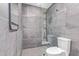 Modern bathroom boasts sleek gray tile, glass-enclosed shower, and contemporary fixtures at 5995 N 78Th St # 2078, Scottsdale, AZ 85250
