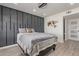Cozy bedroom features a modern accent wall, comfortable bed, and stylish decor at 5995 N 78Th St # 2078, Scottsdale, AZ 85250