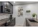 Updated kitchen features modern appliances, stylish backsplash, designer wine rack, and gold fixtures at 5995 N 78Th St # 2078, Scottsdale, AZ 85250