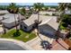 Overhead view of a home with a tile roof, manicured lawn, desert landscaping, and a private driveway at 6577 W Abraham Ln, Glendale, AZ 85308