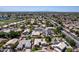Stunning aerial view of a residential neighborhood showcasing well-maintained homes, landscaping and streets at 6577 W Abraham Ln, Glendale, AZ 85308